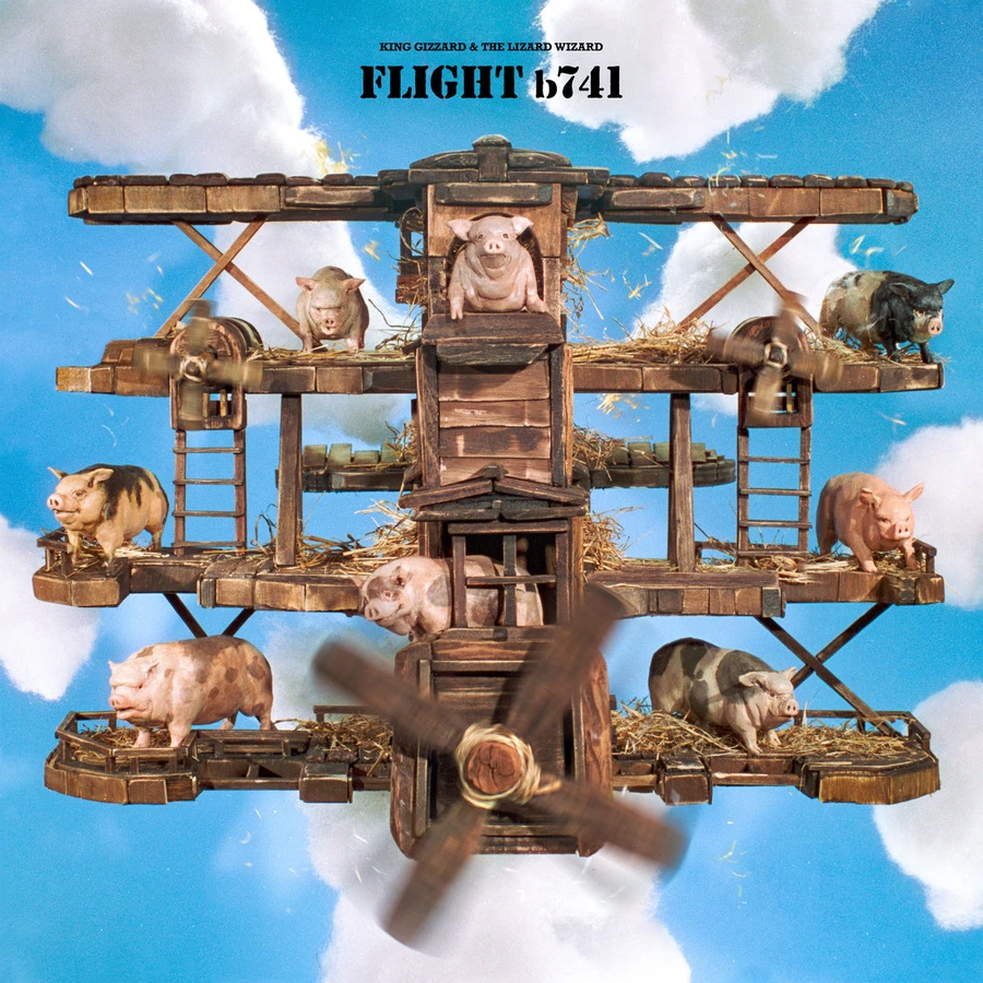 A bunch of pigs flying on an airplane that looks like it was made out of a barn.